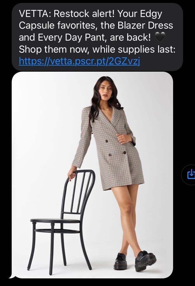 Screenshot of VETTA’s text messaging campaign offering a customer exclusive updates on VETTA’s popular blazer dress and pants being back in stock. 